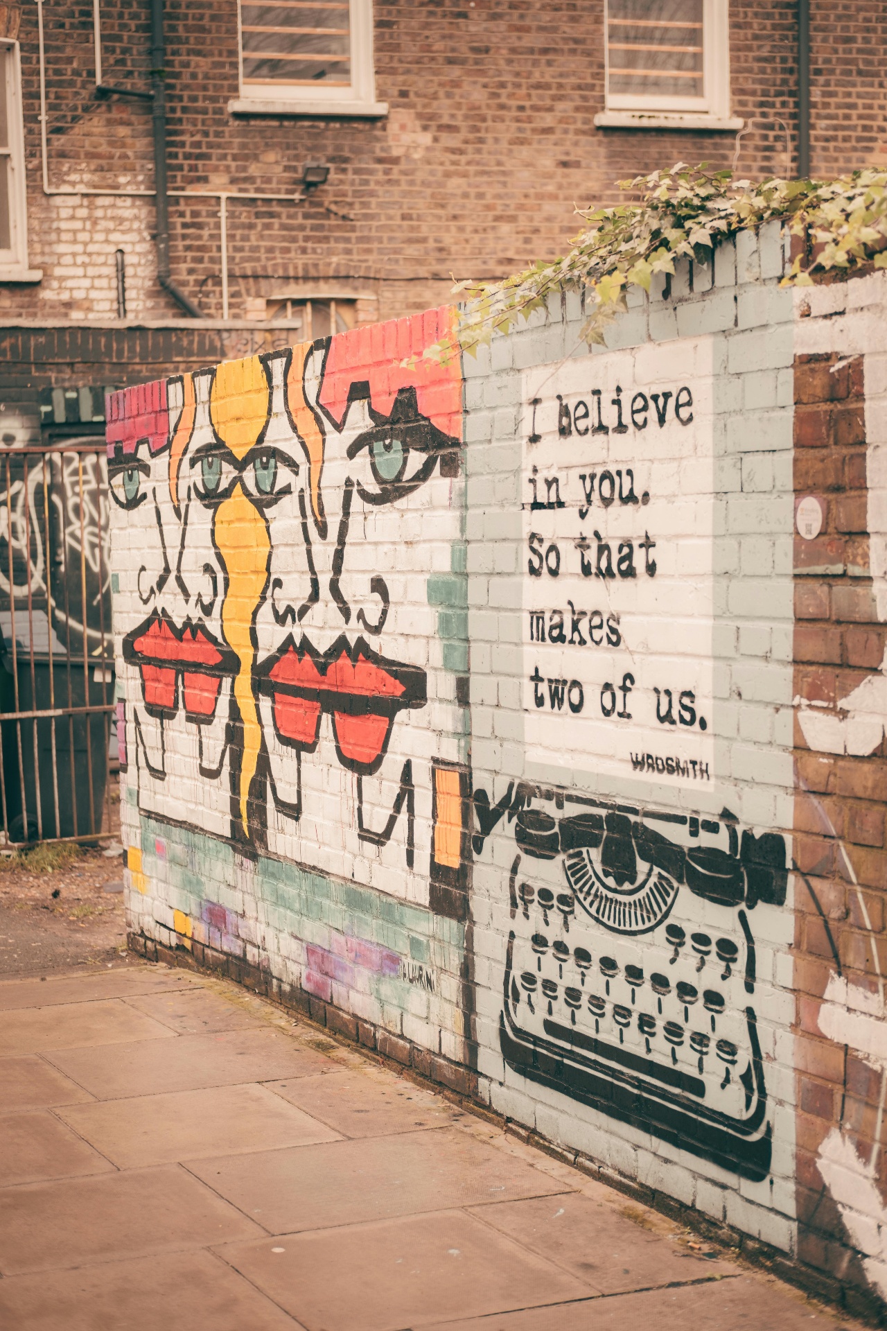 A bold East London street mural - painted faces, a typewriter and the words 'I believe in you' - capturing the spirit of small businesses making their mark